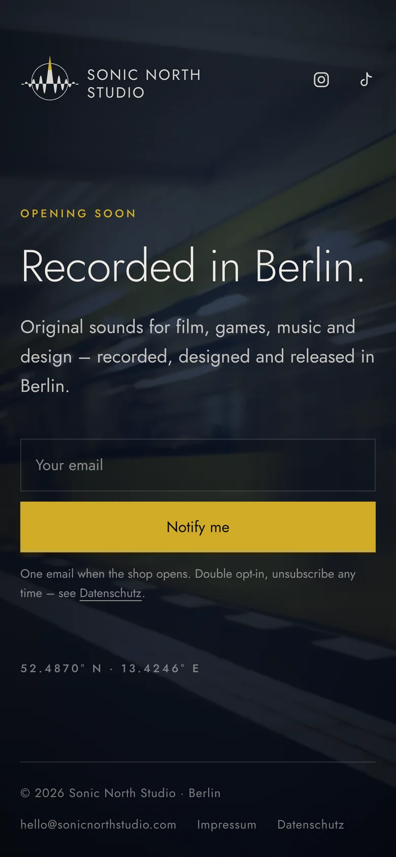 The launch page on a phone: the headline, a short line, an email field and a yellow Notify me button