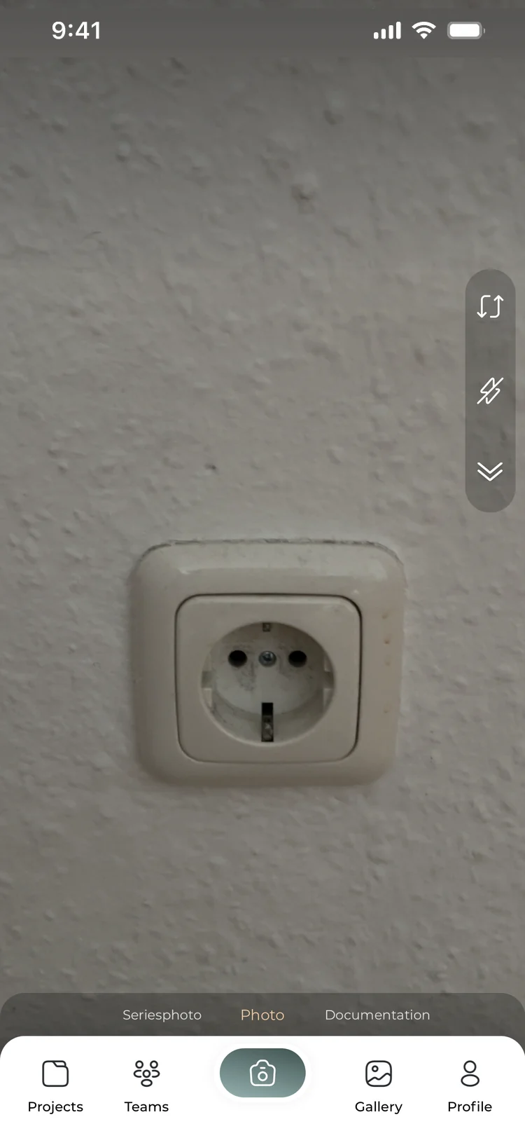The legacy app's camera view, with the shutter button at the centre of the tab bar